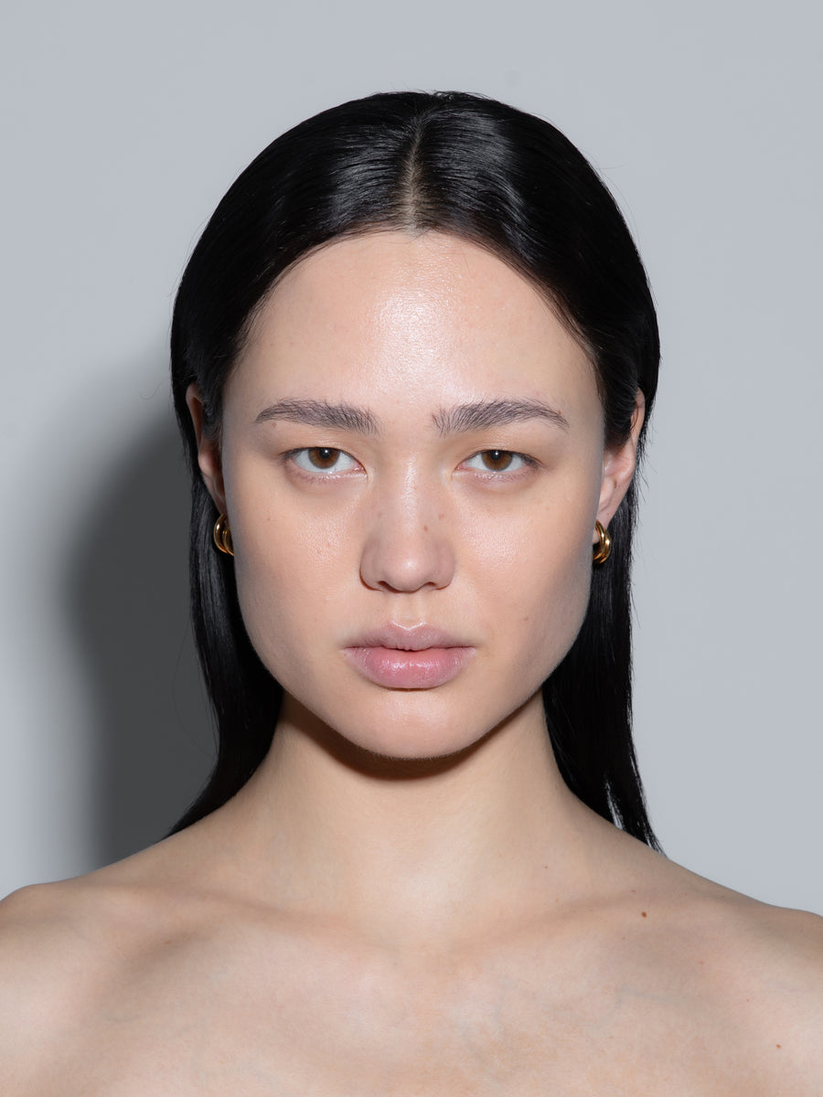 Aeyde | Dean 18k Gold-Plated Hoop Earrings for Women | Luxury Materials | Handmade in Italy | On Model [x=50,y=50]