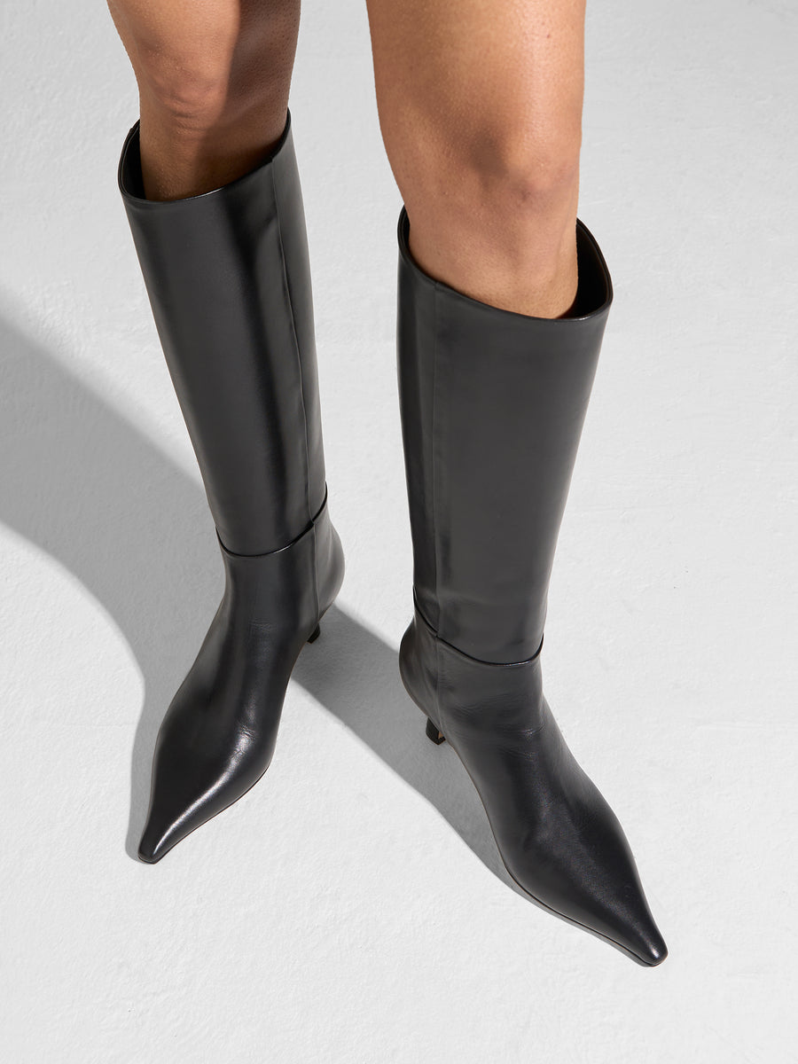Aeyde | Rhea Leather Knee High Boots for Women | Black Calf | Pointed Toe | Mid Heel | On Feet